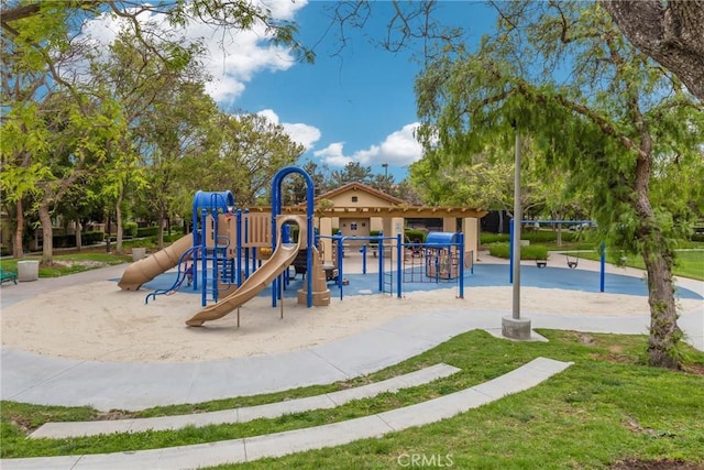 community jungle gym with a yard