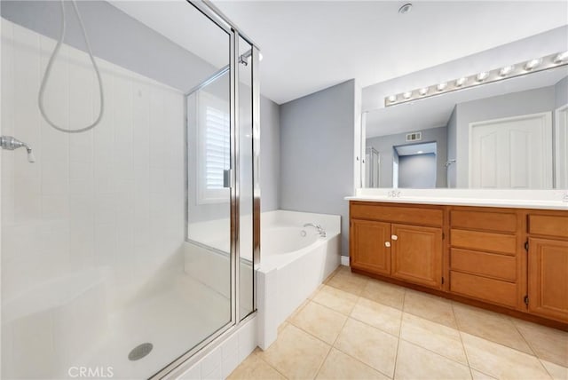 full bath with a sink, tile patterned floors, a shower stall, visible vents, and a bath