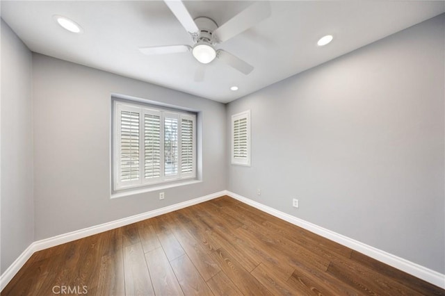 spare room with baseboards, recessed lighting, ceiling fan, and wood finished floors