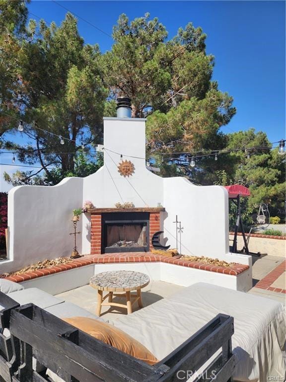 41184 Estates Ln, Palmdale, CA 93551 - view of patio with an outdoor brick fireplace