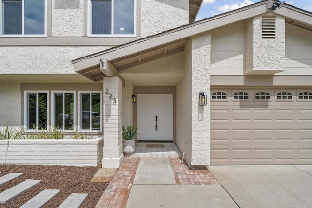 223 Cottingham Ct, Oceanside, CA 92054 - doorway to property featuring stucco siding and an attached garage