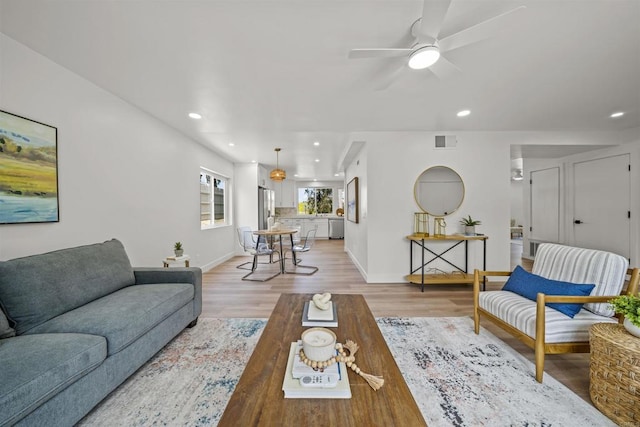 223 Cottingham Ct, Oceanside, CA 92054 - living area with light wood finished floors, ceiling fan, baseboards, and recessed lighting
