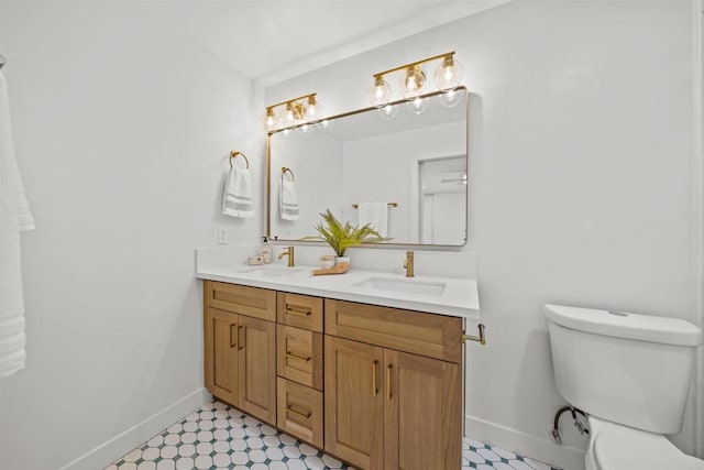 223 Cottingham Ct, Oceanside, CA 92054 - full bathroom with baseboards, double vanity, tile patterned floors, and toilet