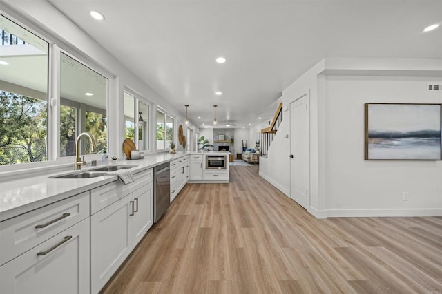 223 Cottingham Ct, Oceanside, CA 92054 - kitchen with open floor plan, dishwasher, recessed lighting, a sink, and a peninsula