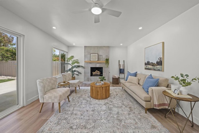 223 Cottingham Ct, Oceanside, CA 92054 - living area featuring wood finished floors, recessed lighting, a fireplace, and a ceiling fan