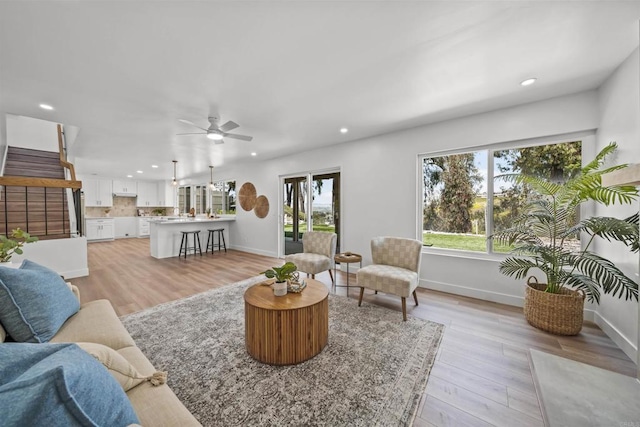 223 Cottingham Ct, Oceanside, CA 92054 - living room with recessed lighting, ceiling fan, light wood-style flooring, and stairs