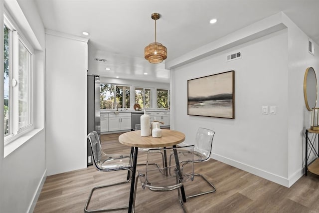 223 Cottingham Ct, Oceanside, CA 92054 - dining room featuring light wood finished floors and recessed lighting