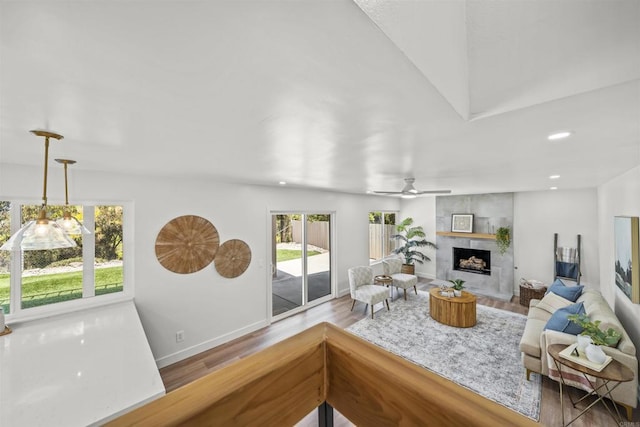 223 Cottingham Ct, Oceanside, CA 92054 - living room with wood finished floors, a premium fireplace, recessed lighting, and ceiling fan