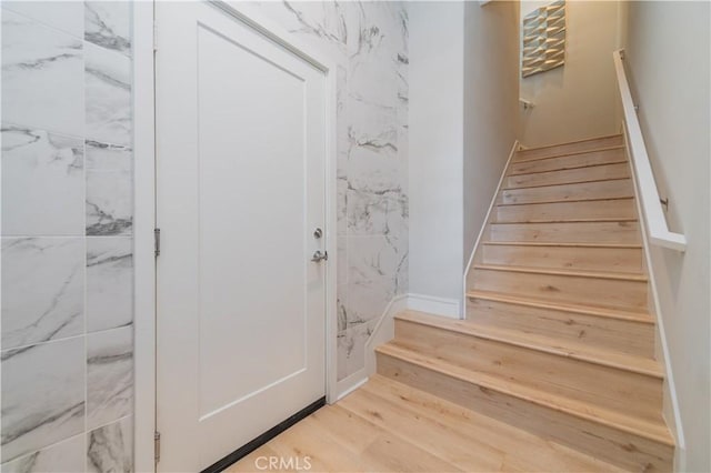 stairs with wood finished floors