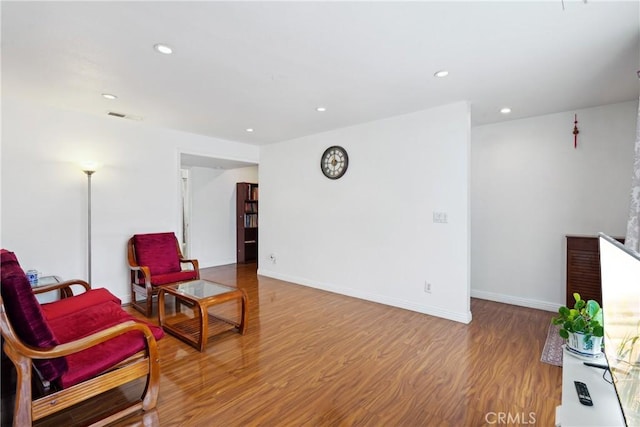 248 E Washington Blvd Unit 10, Pasadena, CA 91104 - living area featuring wood finished floors, recessed lighting, and baseboards