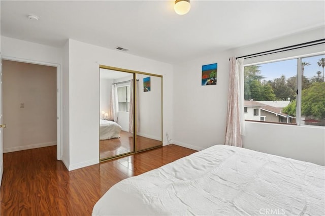 248 E Washington Blvd Unit 10, Pasadena, CA 91104 - bedroom featuring a closet, wood finished floors, and baseboards