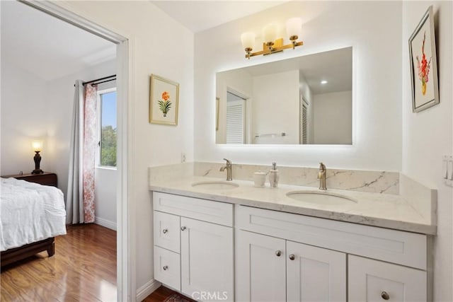 248 E Washington Blvd Unit 10, Pasadena, CA 91104 - ensuite bathroom featuring baseboards, double vanity, and wood finished floors