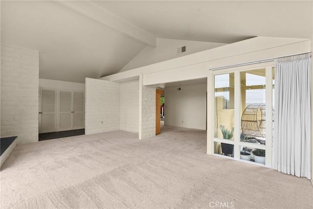 unfurnished living room with high vaulted ceiling, carpet flooring, beam ceiling, and visible vents
