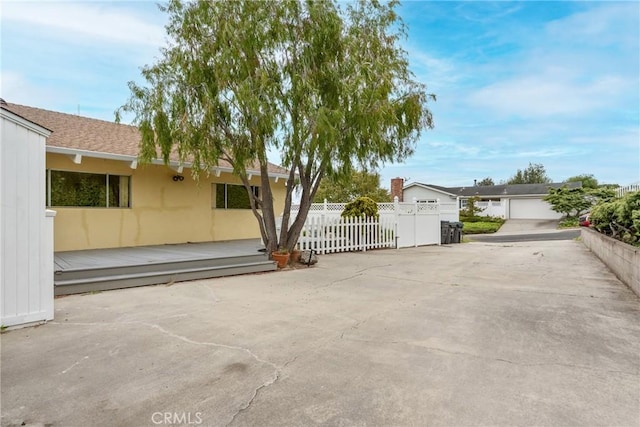 exterior space with fence and stucco siding