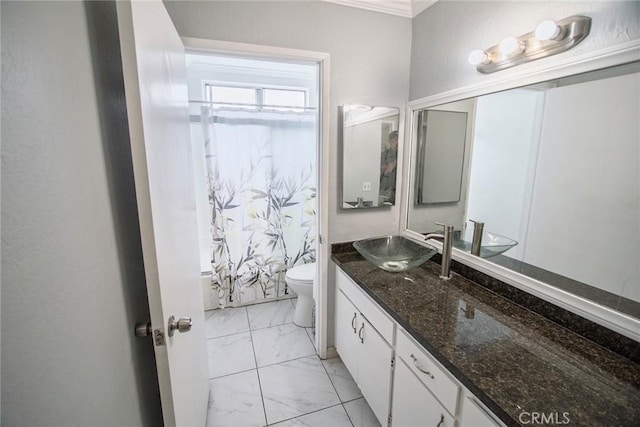 full bath with crown molding, toilet, marble finish floor, and vanity