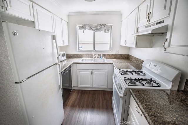 kitchen featuring a sink, white cabinetry, under cabinet range hood, and white appliances