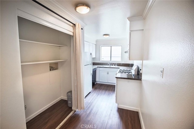 240 W Verdugo Ave Unit K, Burbank, CA 91502 - kitchen featuring freestanding refrigerator, stove, white cabinets, and dark wood-type flooring