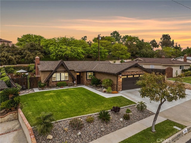 1131 Saint George Dr, San Dimas, CA 91773 - view of front of house featuring fence, a chimney, concrete driveway, an attached garage, and a yard