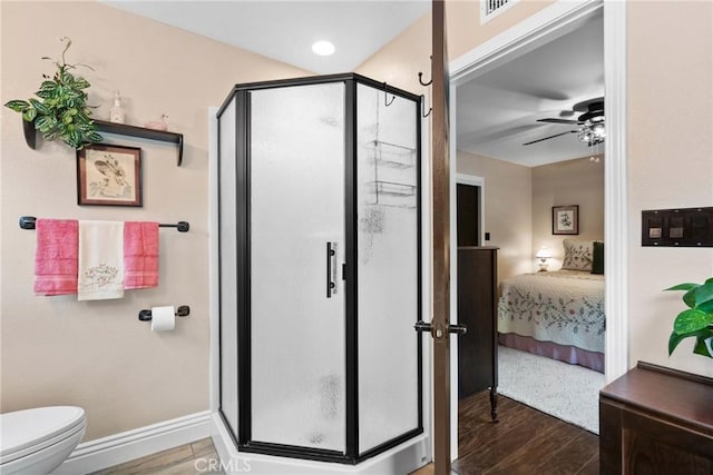 1131 Saint George Dr, San Dimas, CA 91773 - full bath with toilet, a ceiling fan, a shower stall, wood finished floors, and ensuite bathroom