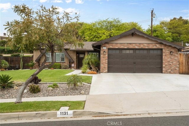 1131 Saint George Dr, San Dimas, CA 91773 - ranch-style house featuring a garage, fence, a front yard, brick siding, and concrete driveway