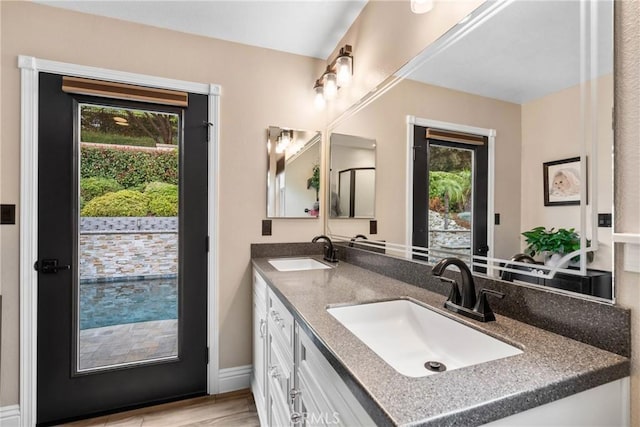 1131 Saint George Dr, San Dimas, CA 91773 - full bath featuring double vanity, a sink, and wood finished floors