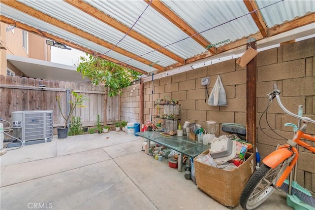 view of patio featuring fence and central AC unit
