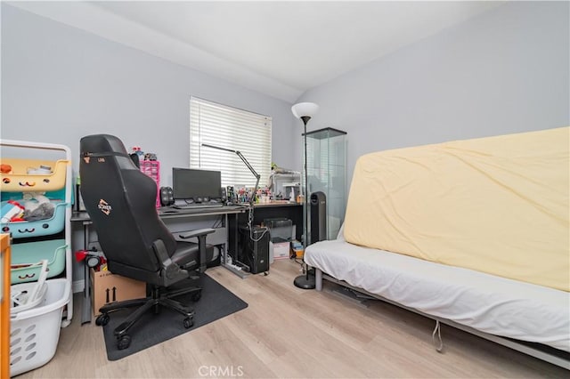bedroom featuring wood finished floors