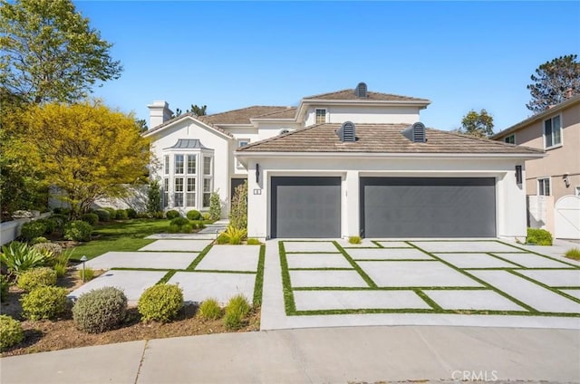 3 Bridgeport Rd, Newport Coast, CA 92657 - view of front facade with a garage, stucco siding, and driveway