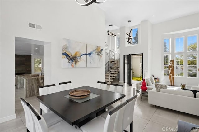 3 Bridgeport Rd, Newport Coast, CA 92657 - dining area with a high ceiling, visible vents, a healthy amount of sunlight, and stairway