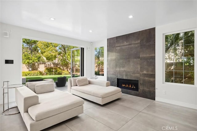 3 Bridgeport Rd, Newport Coast, CA 92657 - living area featuring a tiled fireplace, recessed lighting, and baseboards