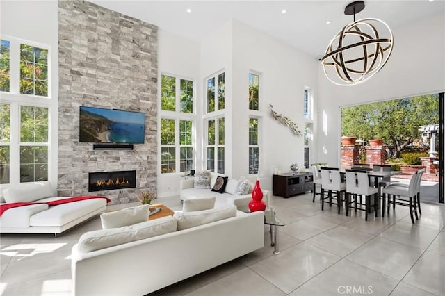 3 Bridgeport Rd, Newport Coast, CA 92657 - living area featuring plenty of natural light, tile patterned floors, a high ceiling, and a fireplace