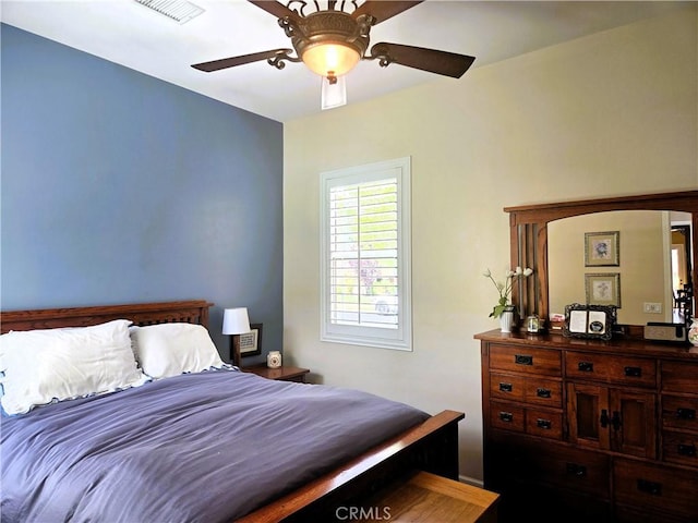 bedroom with a ceiling fan and visible vents