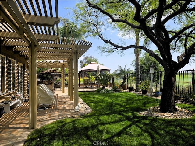 view of yard with a fenced backyard, a pergola, and a patio area