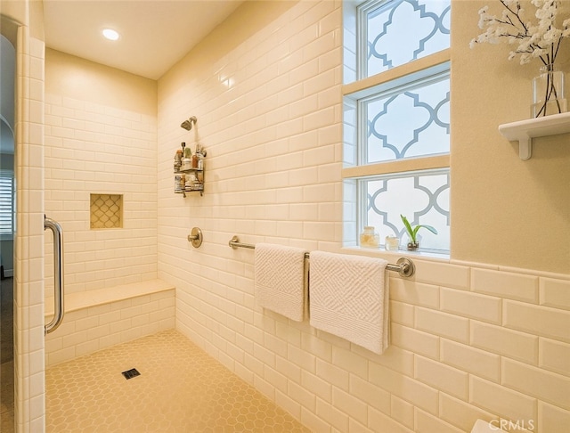 bathroom with a tile shower