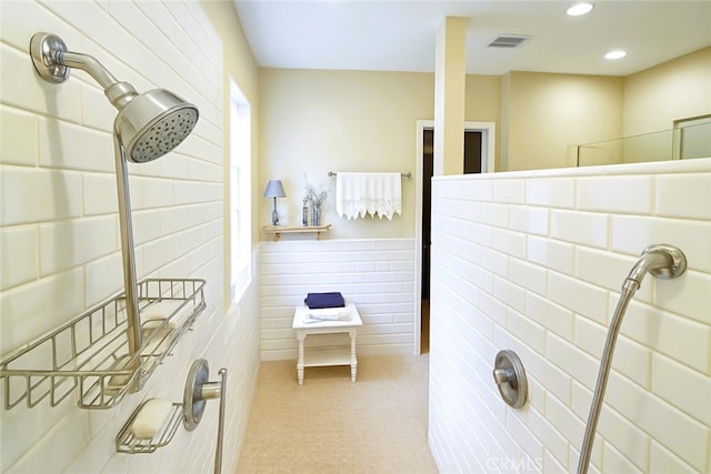 full bath featuring walk in shower, visible vents, and recessed lighting