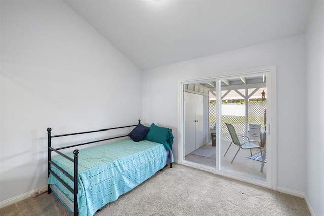bedroom with access to outside, baseboards, carpet, and lofted ceiling