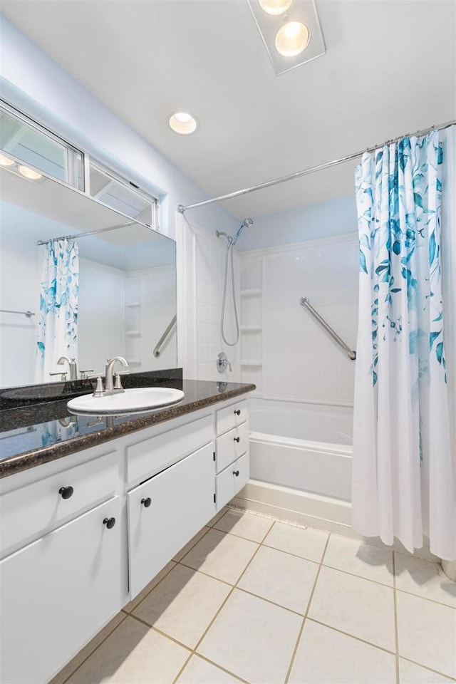 full bath featuring shower / bath combo with shower curtain, recessed lighting, tile patterned flooring, and vanity