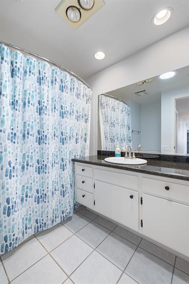 3685 Vista Campana N Unit 61, Oceanside, CA 92057 - full bathroom featuring vanity, tile patterned flooring, and a shower with shower curtain