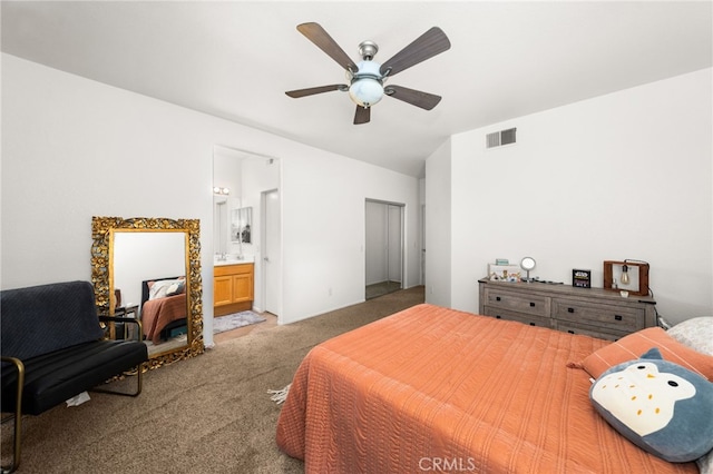 carpeted bedroom with ceiling fan, vaulted ceiling, connected bathroom, and visible vents
