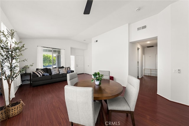 dining room with ceiling fan, visible vents, wood finished floors, and vaulted ceiling