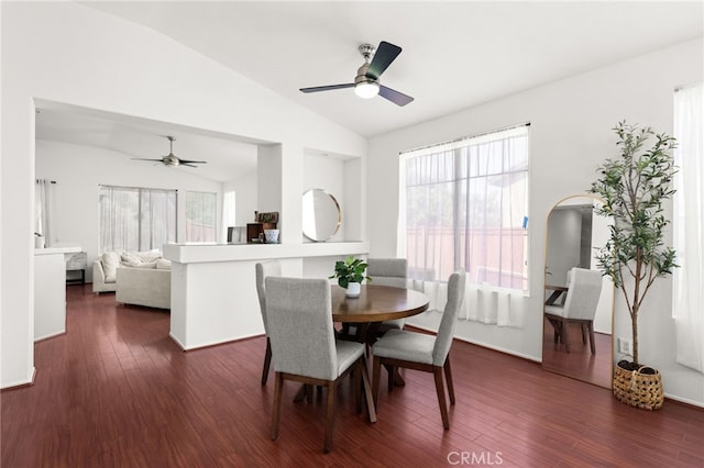 dining area with a healthy amount of sunlight, ceiling fan, dark wood-style floors, and lofted ceiling