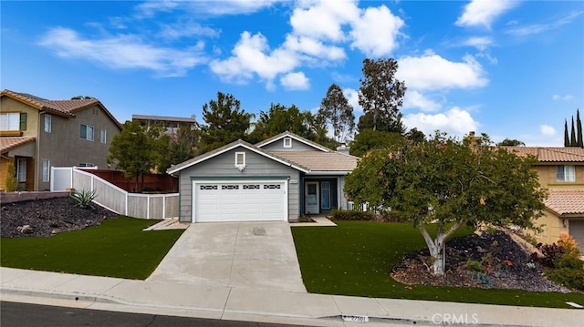 single story home with a tiled roof, fence, a front lawn, concrete driveway, and an attached garage