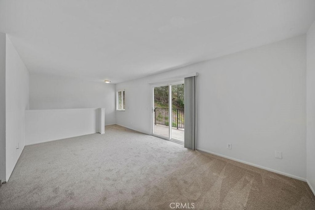 interior space featuring carpet floors and baseboards