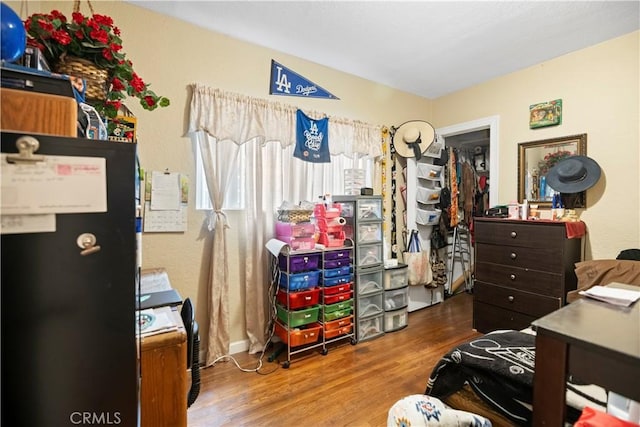 bedroom with wood finished floors