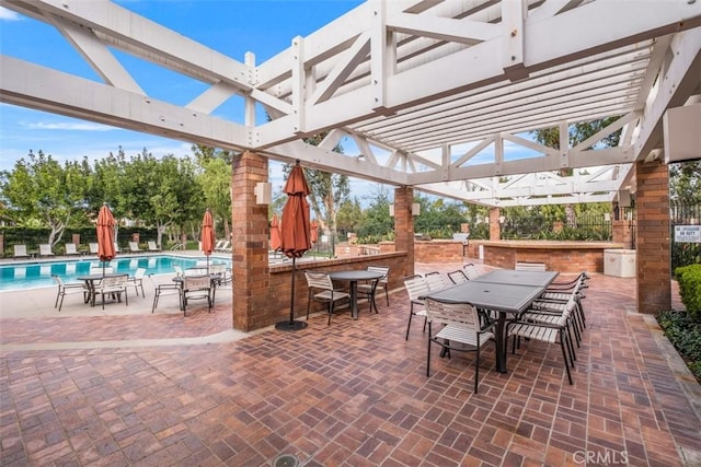 8 Recodo, Irvine, CA 92620 - view of patio featuring outdoor dining area, a pergola, and a community pool