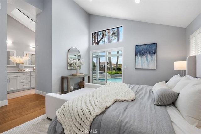 8 Recodo, Irvine, CA 92620 - bedroom with access to exterior, high vaulted ceiling, light wood-style flooring, and ensuite bath