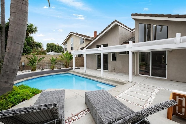 view of pool featuring fence, a patio, and a pergola