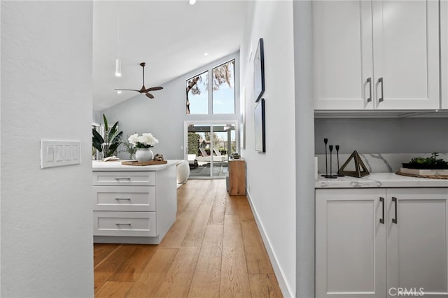 8 Recodo, Irvine, CA 92620 - hall featuring light wood finished floors, high vaulted ceiling, recessed lighting, and baseboards