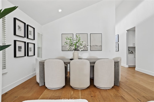 8 Recodo, Irvine, CA 92620 - dining area featuring baseboards, light wood finished floors, high vaulted ceiling, and recessed lighting