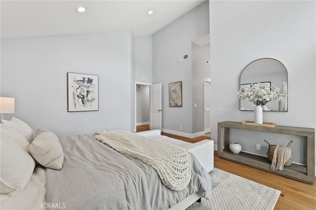 8 Recodo, Irvine, CA 92620 - bedroom with wood finished floors, high vaulted ceiling, recessed lighting, and baseboards